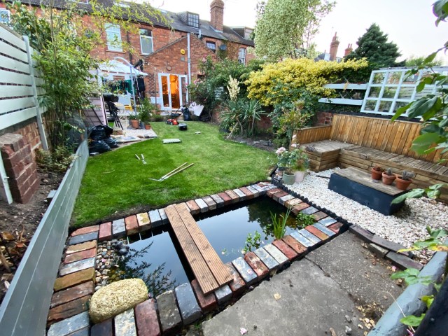 Small rectangular pond at bottom of garden