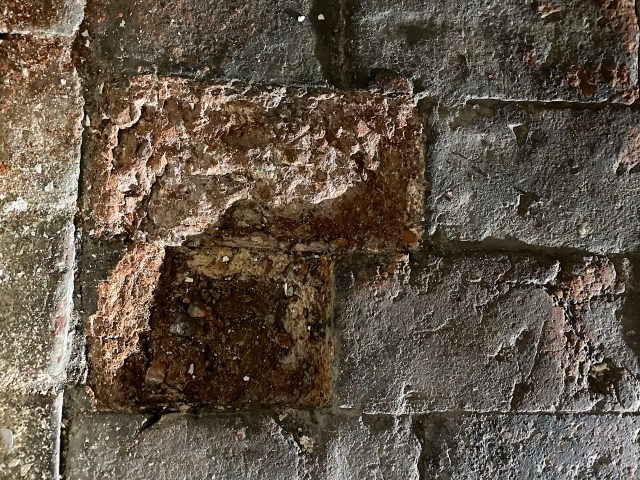 spalling brick floor