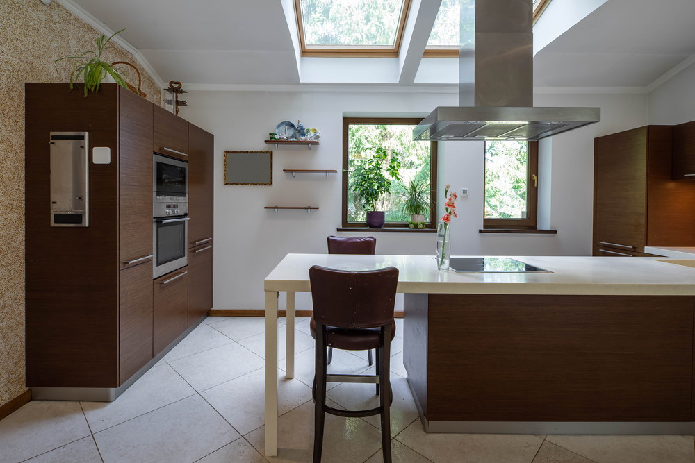 Modern kitchen with large roof windows letting in extra light