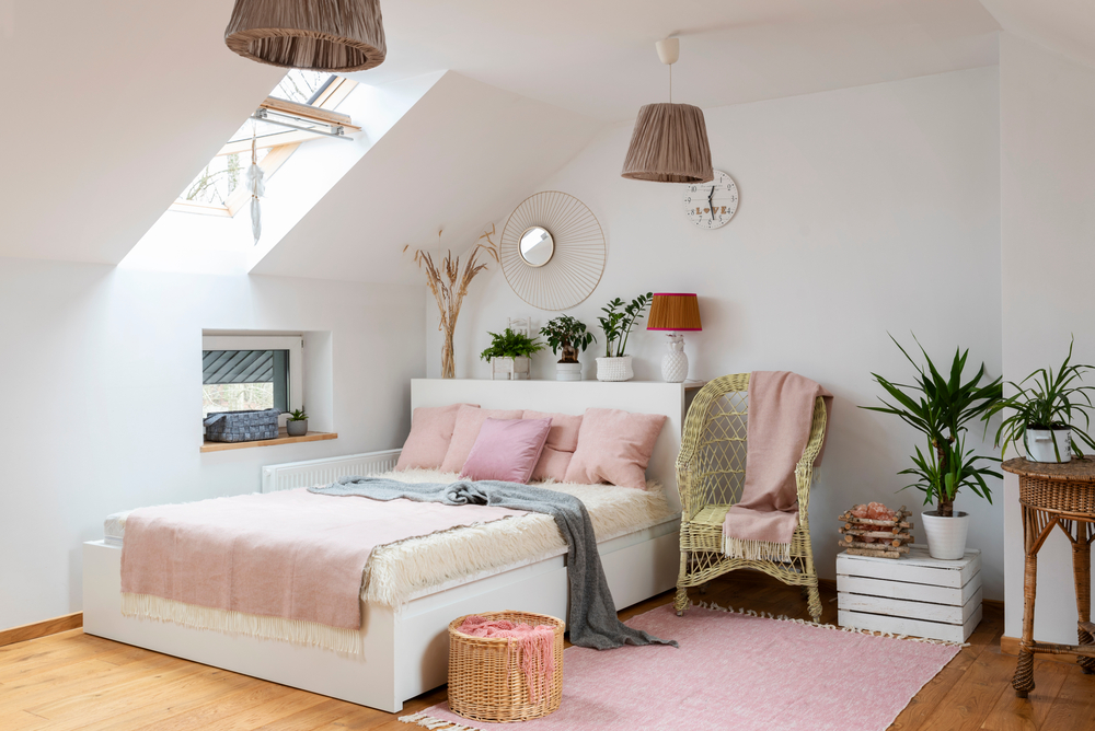 Pink and green teenage bedroom in an attic conversion