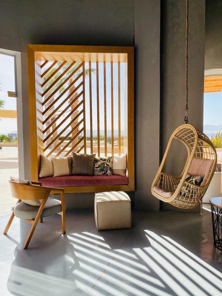 Contemporary hanging chair made from wicker