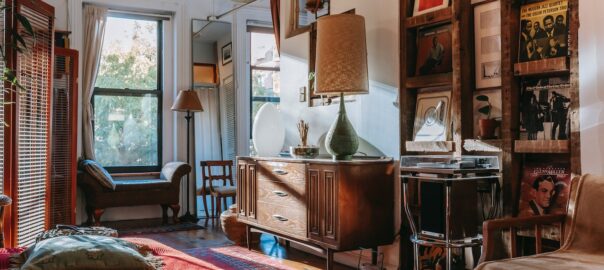 A living room with multiple examples of how beautiful your home can be when you restore old furniture pieces.