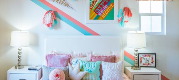 decorate your home with kids using vibrant colors and colorful pillows in their bedroom